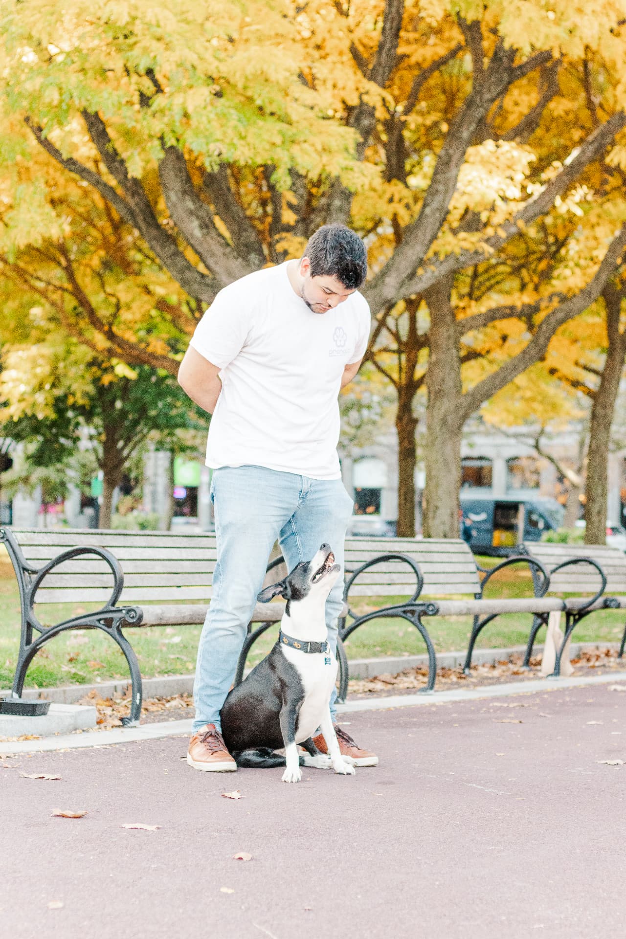 Jaime with his dog outdoors on an autumn day